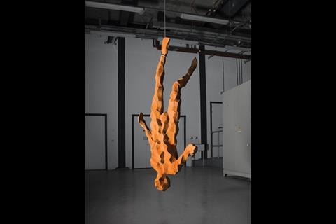 Antony Gormley’s figurative sculpture hangs next to the digital manufacturing machine used to create it